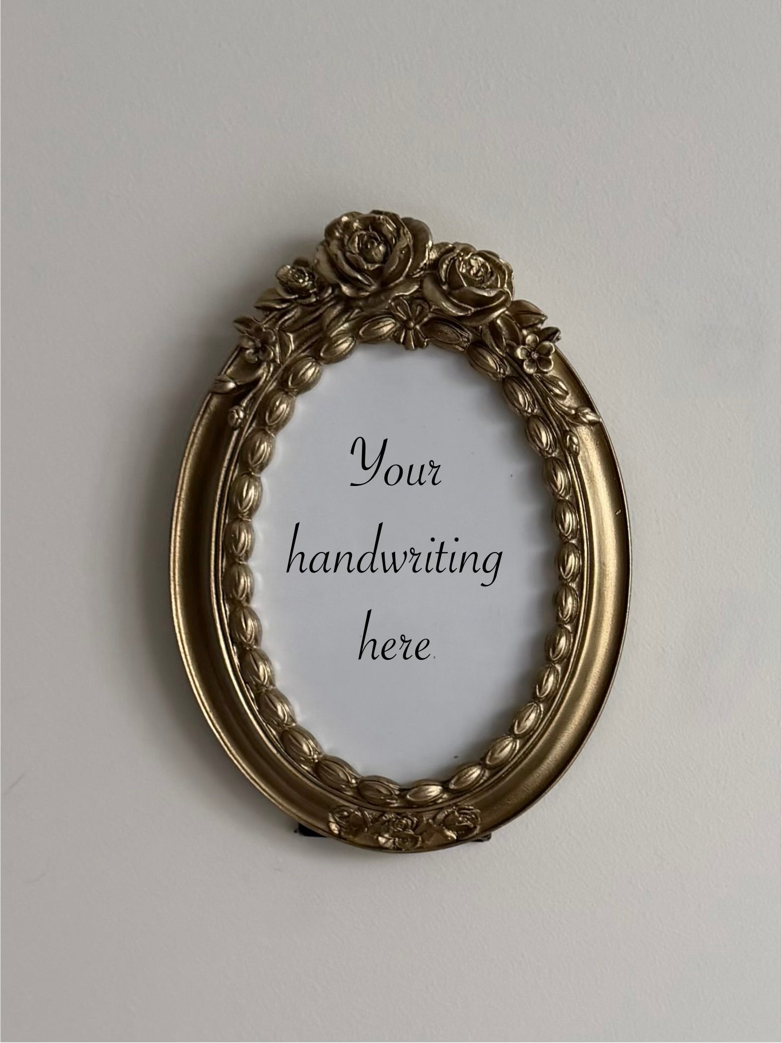 Gold oval frame with flowers - 6 x 4 inch opening